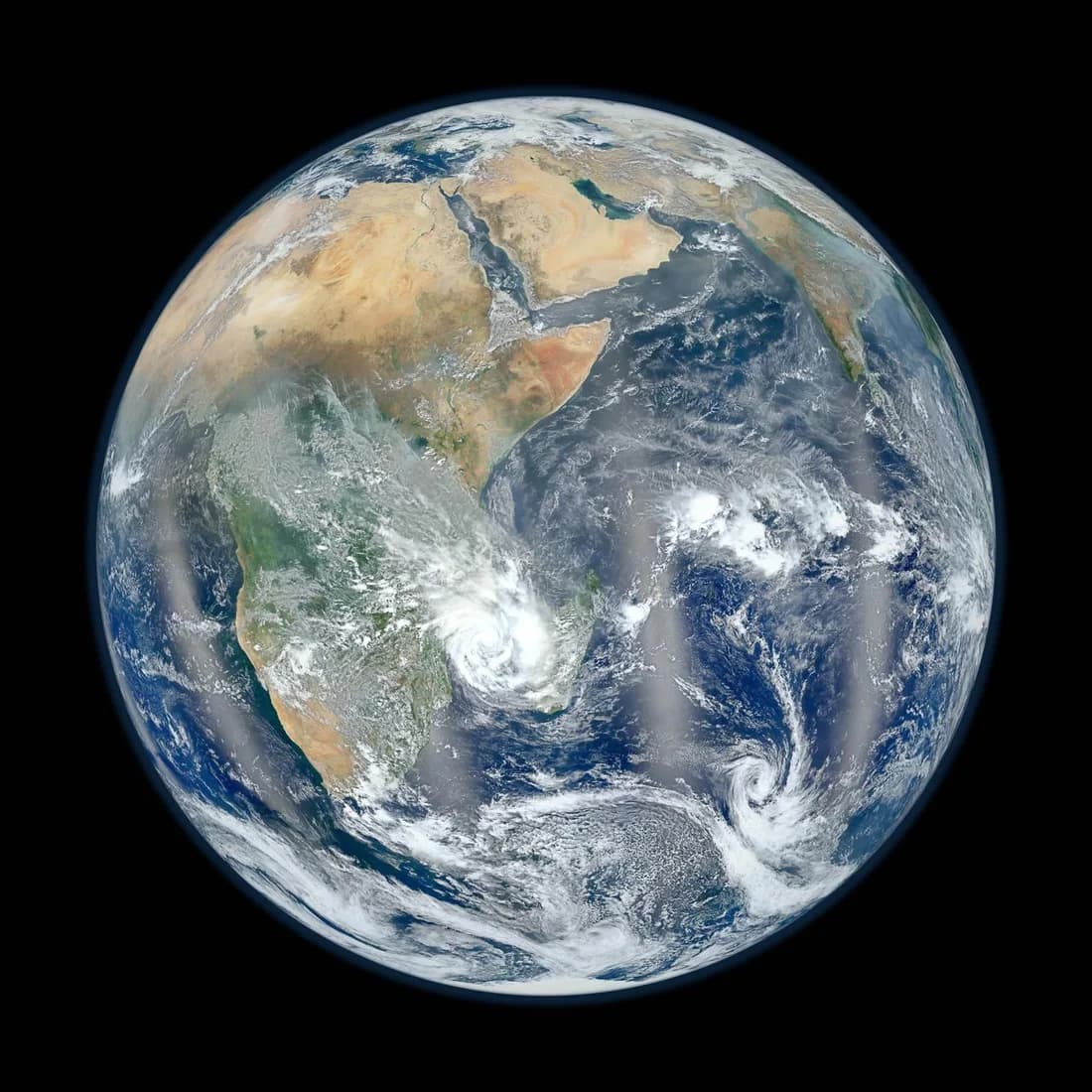 Earth's blue oceans, white clouds and land seen from space